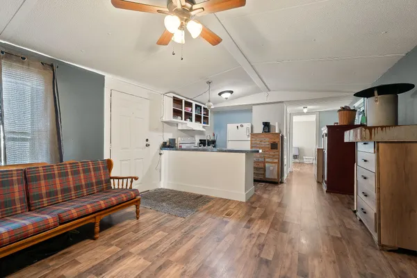 a kitchen with stainless steel appliances granite countertop a refrigerator and a sink