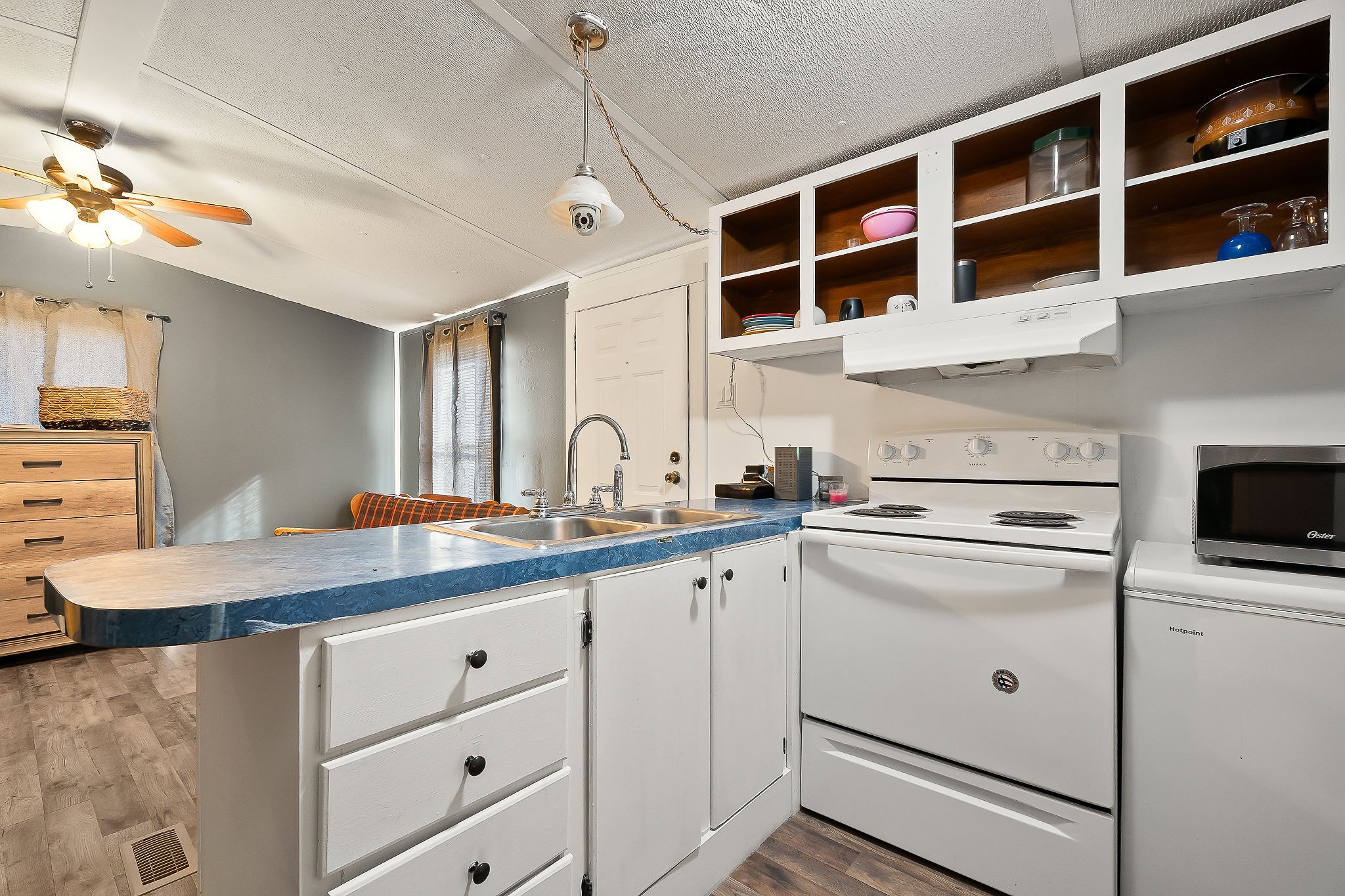 280 Bone Cave Road Rock Island, TN 38581 - Photo 8 of 27 a kitchen that has a sink and a stove in it