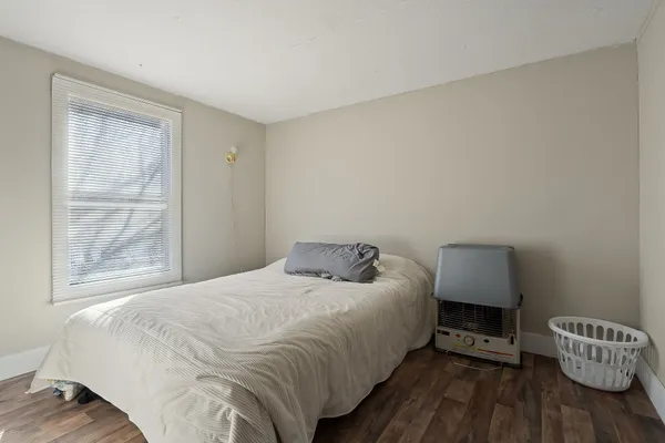 a bedroom with a bed and closet