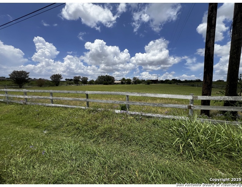 a view of a lake with a big yard