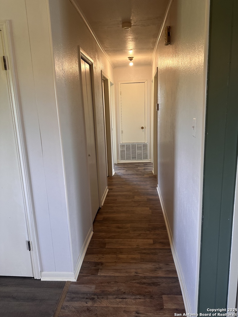 1219 Weil Road Marion, TX 78124 - Photo 3 of 4 a view of a hallway with wooden floor