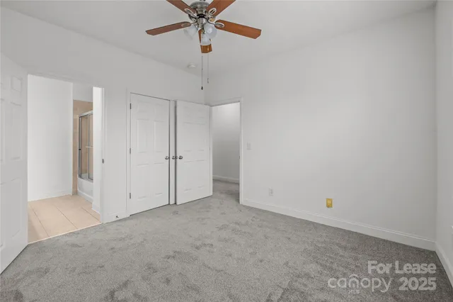 a view of a balcony with wooden floor and fence