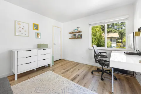 a workspace with furniture and a window