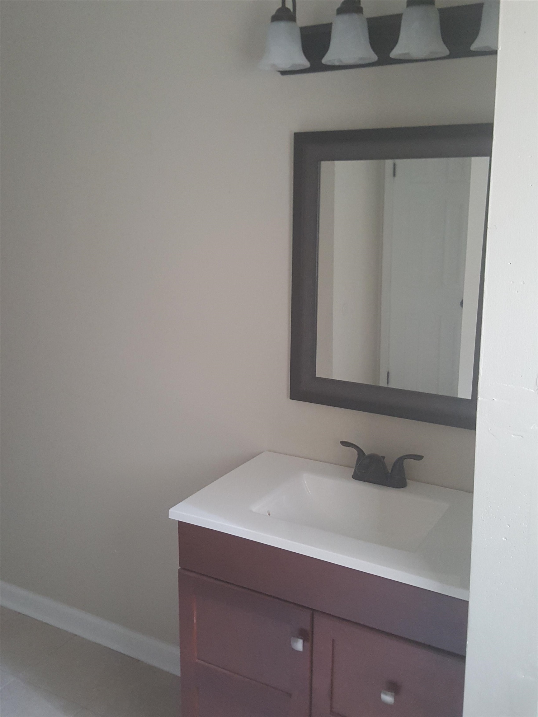 3667 Windermere Road Memphis, TN 38128 - Photo 6 of 8 Bathroom featuring vanity and baseboards