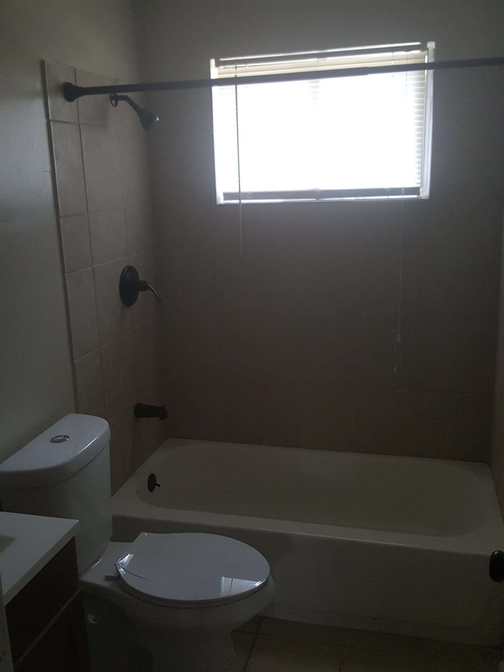 3667 Windermere Road Memphis, TN 38128 - Photo 8 of 8 Bathroom with tile patterned flooring, toilet, vanity, and shower combination