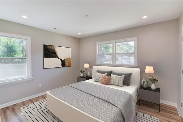 a bedroom with a bed and window