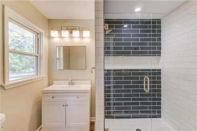 a bathroom with a sink a vanity and a mirror