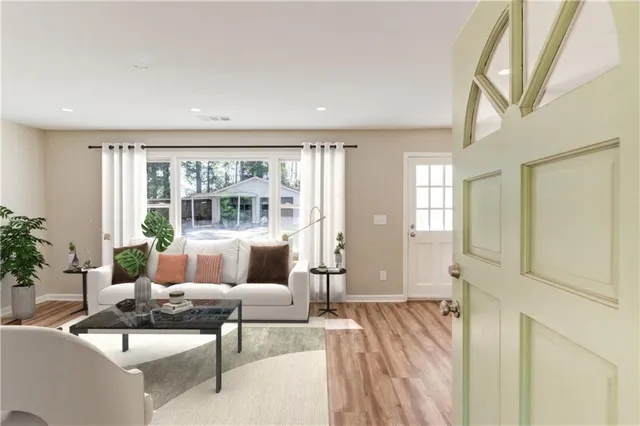 a living room with furniture and a large window