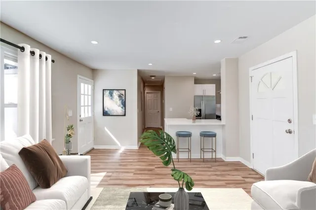 a living room with furniture and a large window