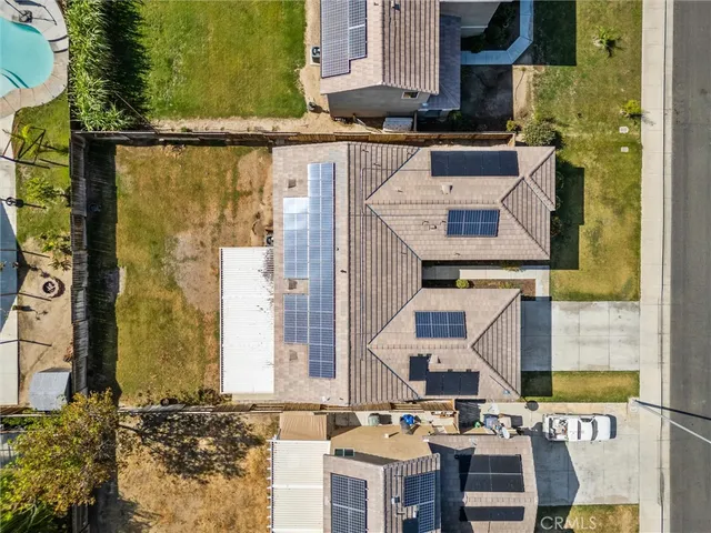 an aerial view of residential houses with outdoor space