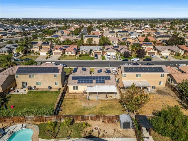 an aerial view of a house with a ocean view