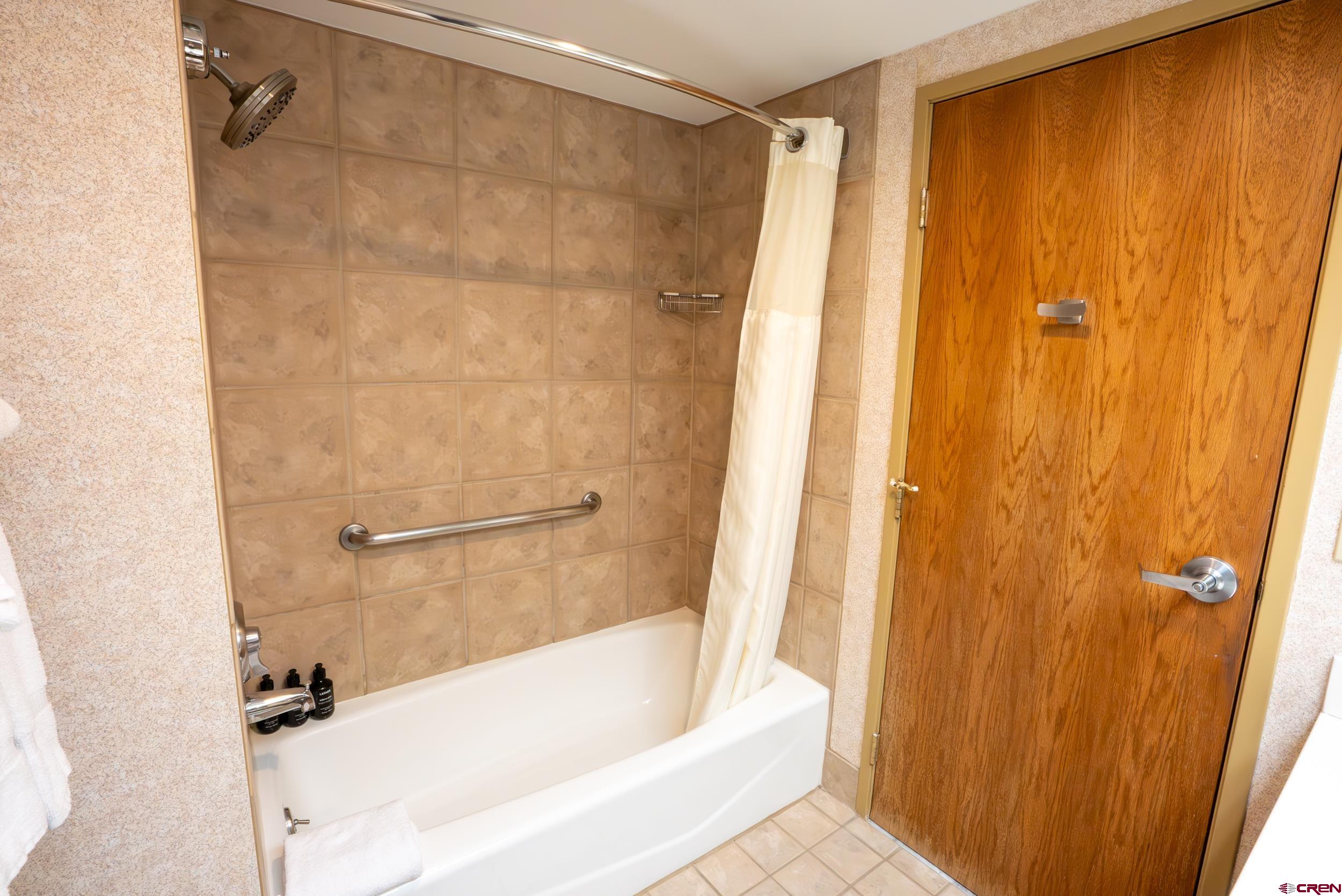 6 Emmons Road, Unit 474 Crested Butte, CO 81225 - Photo 11 of 22 a bathroom with a shower and a bath tub