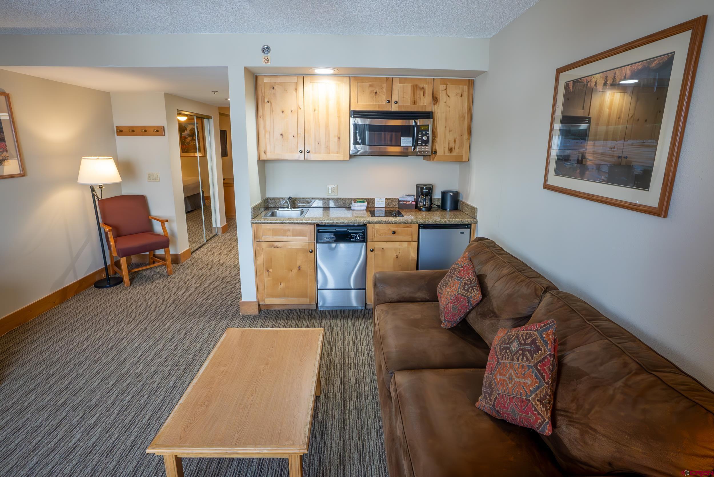 6 Emmons Road, Unit 474 Crested Butte, CO 81225 - Photo 6 of 22 a living room with furniture and a window