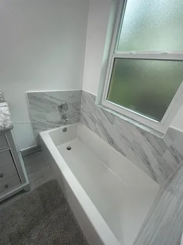 a bathroom with a bathtub