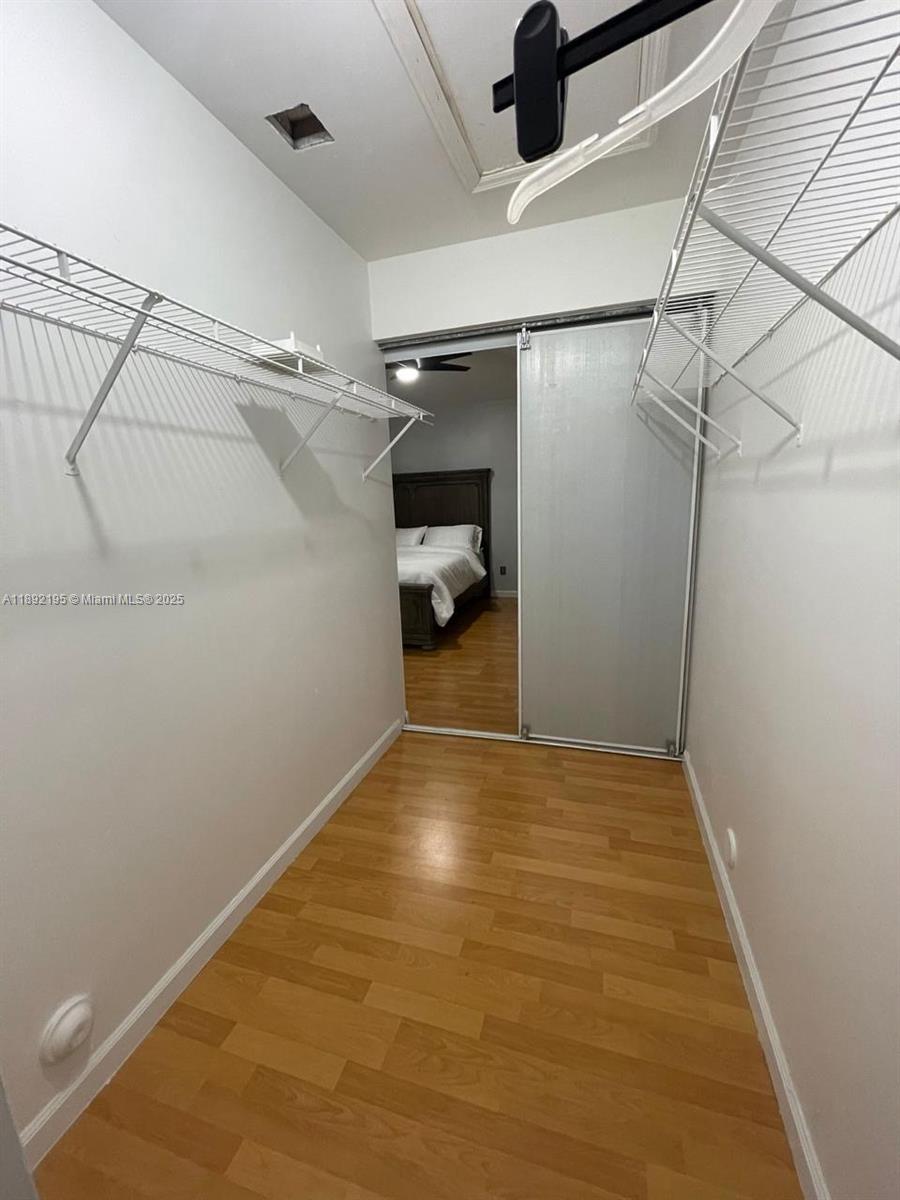 10470 Southwest 16th Street Pembroke Pines, FL 33025 - Photo 9 of 26 a view of a room with racks on the wall