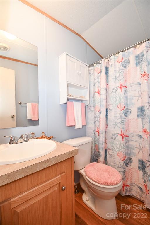 1426 Clontz Long Road Monroe, NC 28110 - Photo 11 of 12 a bathroom with a sink toilet vanity and shower