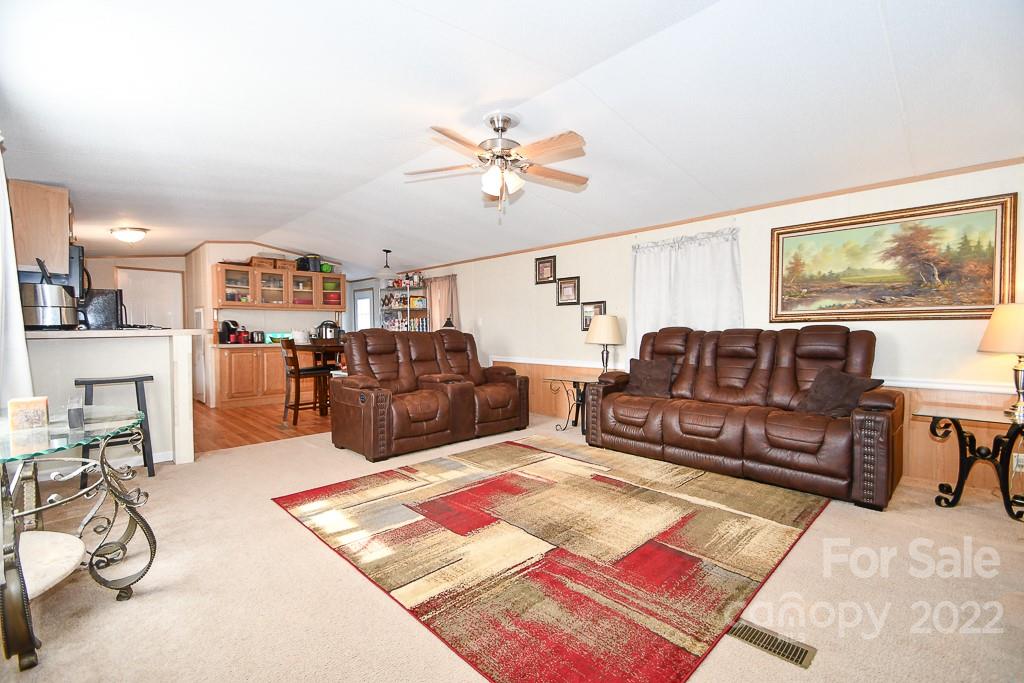 1426 Clontz Long Road Monroe, NC 28110 - Photo 4 of 12 a living room with furniture kitchen view and a table