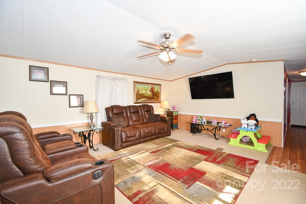 1426 Clontz Long Road Monroe, NC 28110 - Photo 5 of 12 a living room with furniture and a flat screen tv