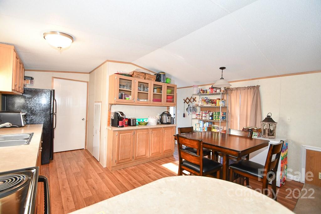 1426 Clontz Long Road Monroe, NC 28110 - Photo 6 of 12 a dining room with furniture and wooden floor