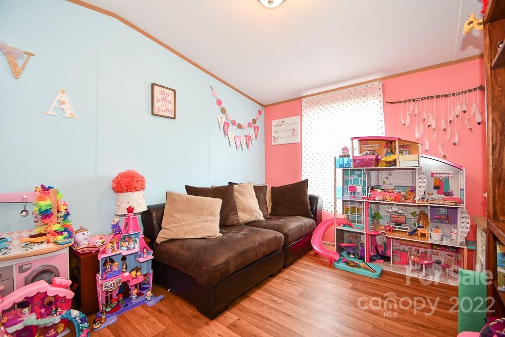 1426 Clontz Long Road Monroe, NC 28110 - Photo 8 of 12 a living room with lots of baby toys