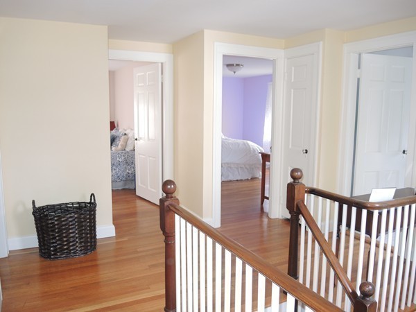 90 Elmwood Road Needham, MA 02492 - Photo 14 of 20 a view of a hallway with wooden floor and staircase