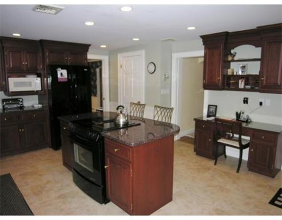 90 Elmwood Road Needham, MA 02492 - Photo 7 of 20 a kitchen with stainless steel appliances granite countertop a stove a sink and a refrigerator