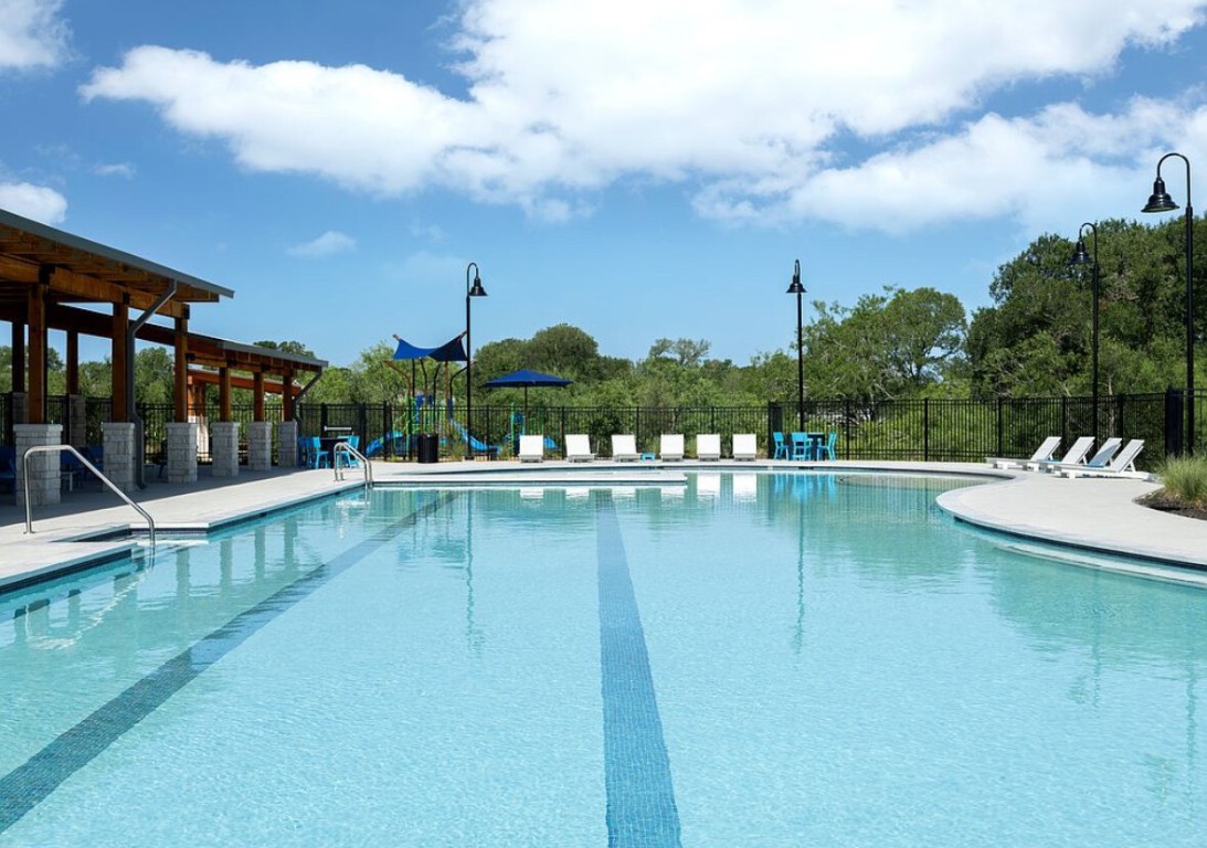 126 Short Toed Swoop Cedar Creek, TX 78612 - Photo 13 of 20 a view of a swimming pool with a patio