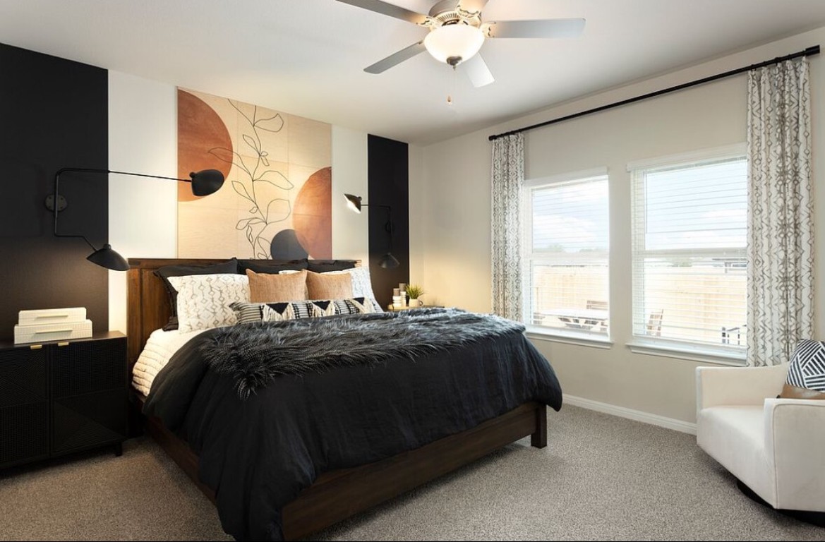 126 Short Toed Swoop Cedar Creek, TX 78612 - Photo 8 of 20 a bedroom with a bed and a large window