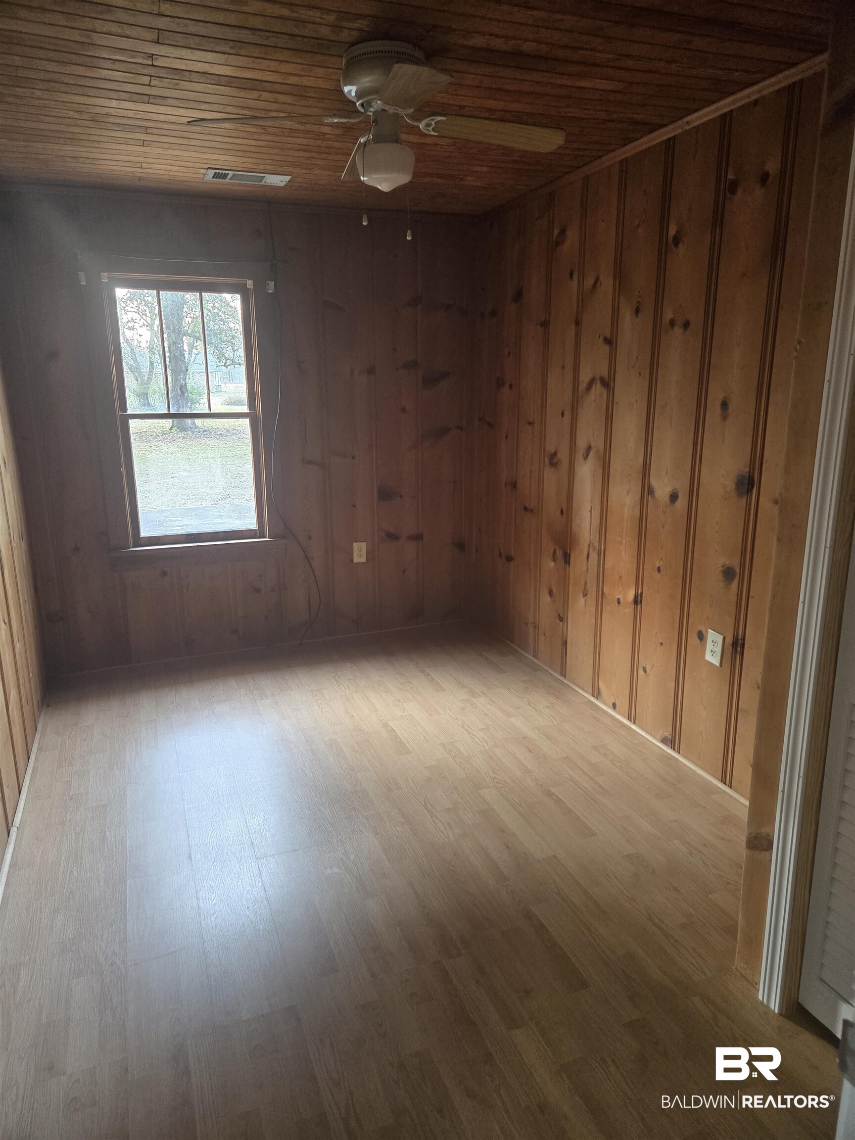16360 Tolbert Road Bay Minette, AL 36507 - Photo 7 of 14 Unfurnished room featuring wood finished floors, ceiling fan, wood walls, and wood ceiling