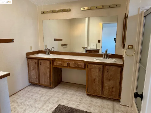 a utility room with wooden floor washer and dryer