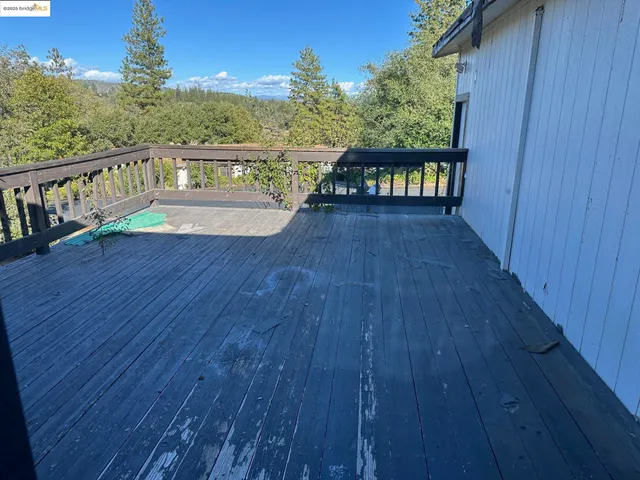 a view of two chairs on wooden deck