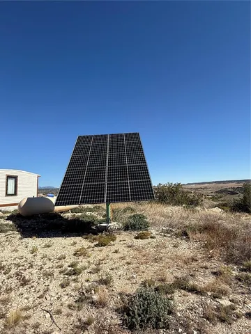 a view of a backyard of the house