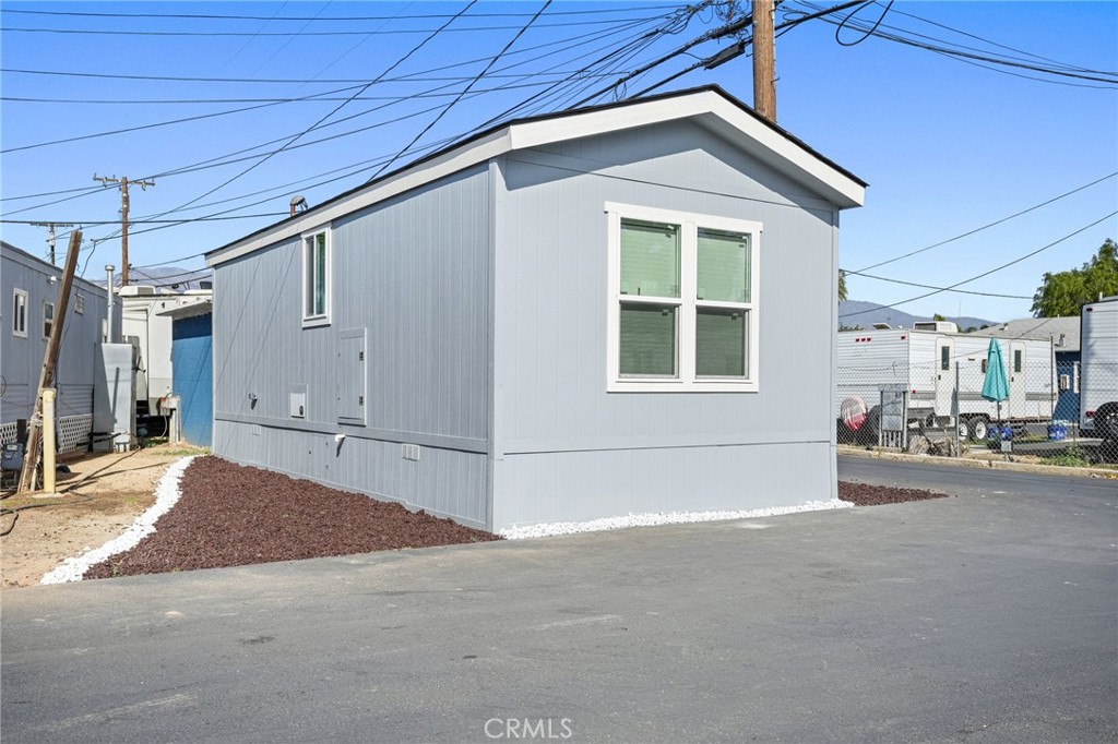 525 Palm Avenue, Unit 30 Beaumont, CA 92223 - Photo 1 of 18 a view of a house with a garage