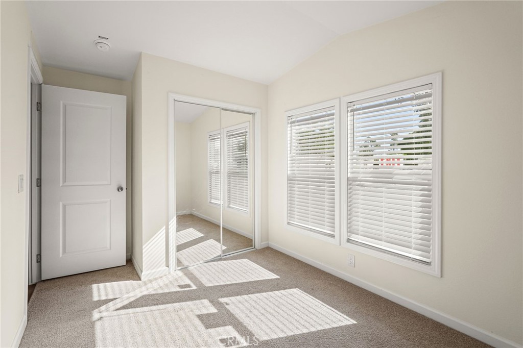 525 Palm Avenue, Unit 30 Beaumont, CA 92223 - Photo 14 of 18 a view of an empty room with glass door