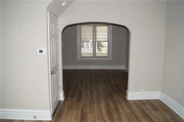 a view of front door with wooden floor