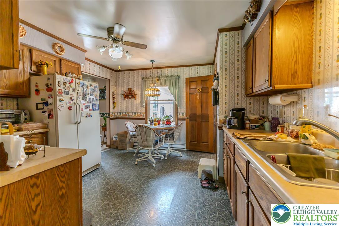 40 Locke Heights Road Bangor, PA 18013 - Photo 15 of 28 A classic kitchen with durable tile flooring and a functional dining area, perfect for everyday meals.