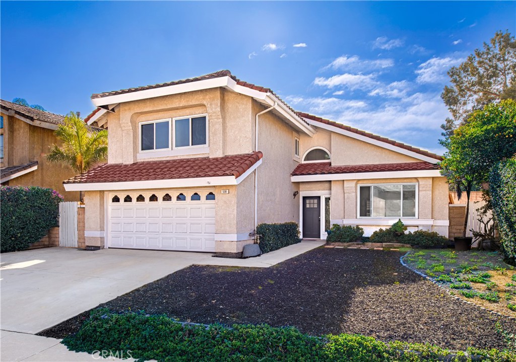 530 Conestoga Road San Dimas, CA 91773 - Photo 1 of 45 a view of a house with a yard