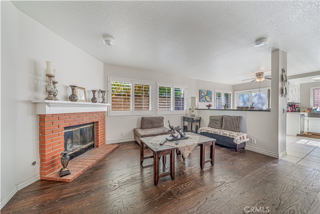 530 Conestoga Road San Dimas, CA 91773 - Photo 15 of 45 a living room with furniture and a fireplace