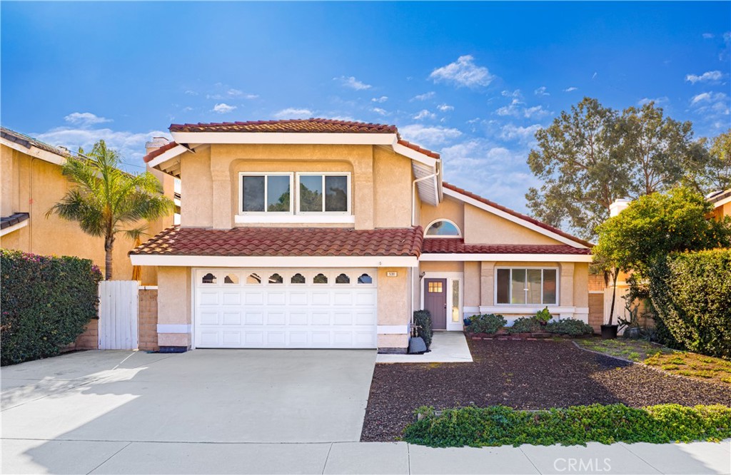 530 Conestoga Road San Dimas, CA 91773 - Photo 2 of 45 a front view of a house with a yard and garage
