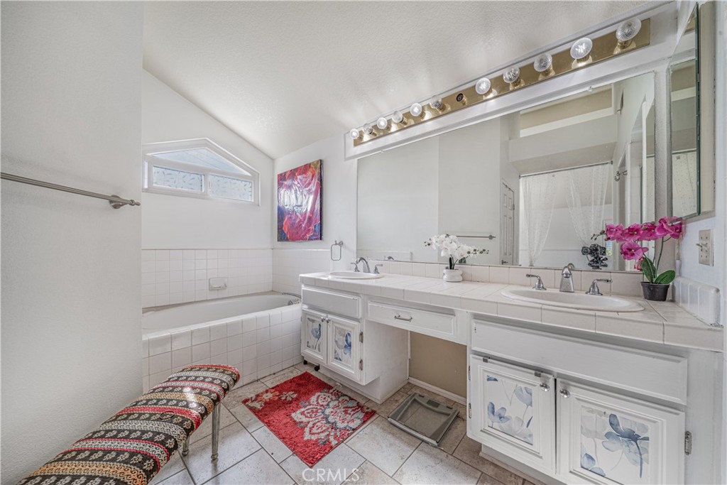 530 Conestoga Road San Dimas, CA 91773 - Photo 26 of 45 a bathroom with a sink a vanity and a mirror