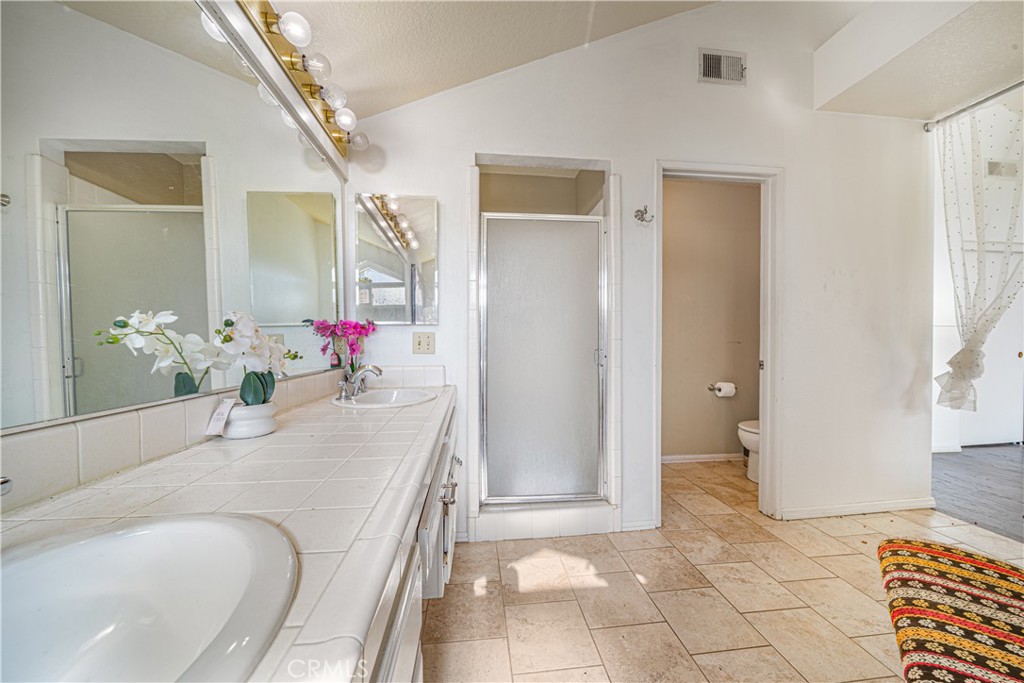 530 Conestoga Road San Dimas, CA 91773 - Photo 27 of 45 a bath room with a bath tub and shower