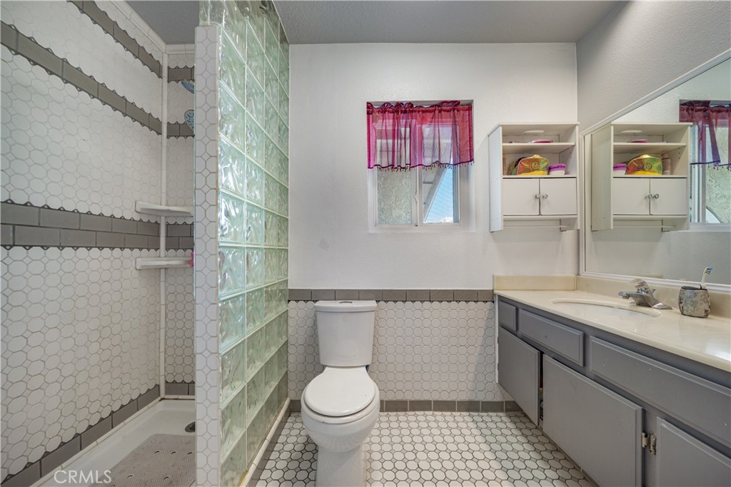 530 Conestoga Road San Dimas, CA 91773 - Photo 28 of 45 a bathroom with a sink a toilet and shower