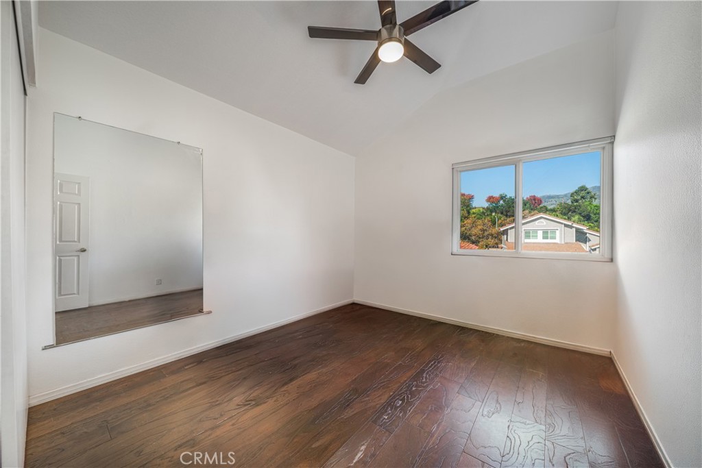 530 Conestoga Road San Dimas, CA 91773 - Photo 34 of 45 an empty room with wooden floor closet and windows