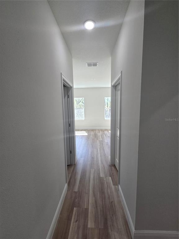 2644 Southwest 162nd Street Road Ocala, FL 34473 - Photo 33 of 47 a view of hallway with wooden floor