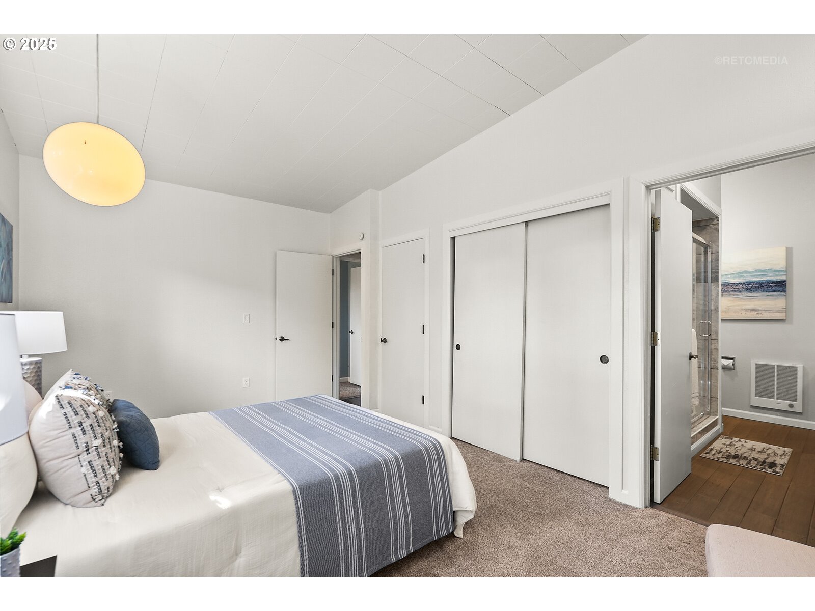 57647 Cedar Springs Drive Scappoose, OR 97056 - Photo 16 of 48 a bedroom with a bed and cabinets