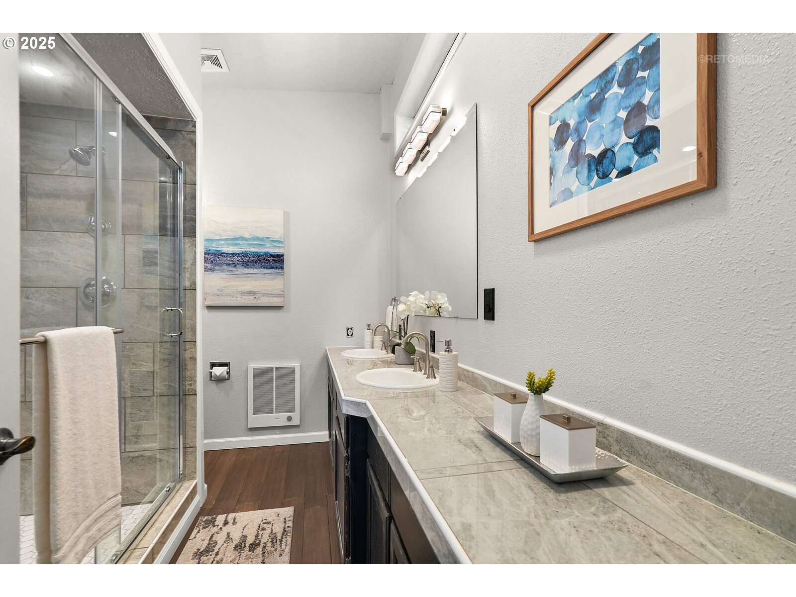 57647 Cedar Springs Drive Scappoose, OR 97056 - Photo 17 of 48 a bathroom with a sink a mirror and a shower