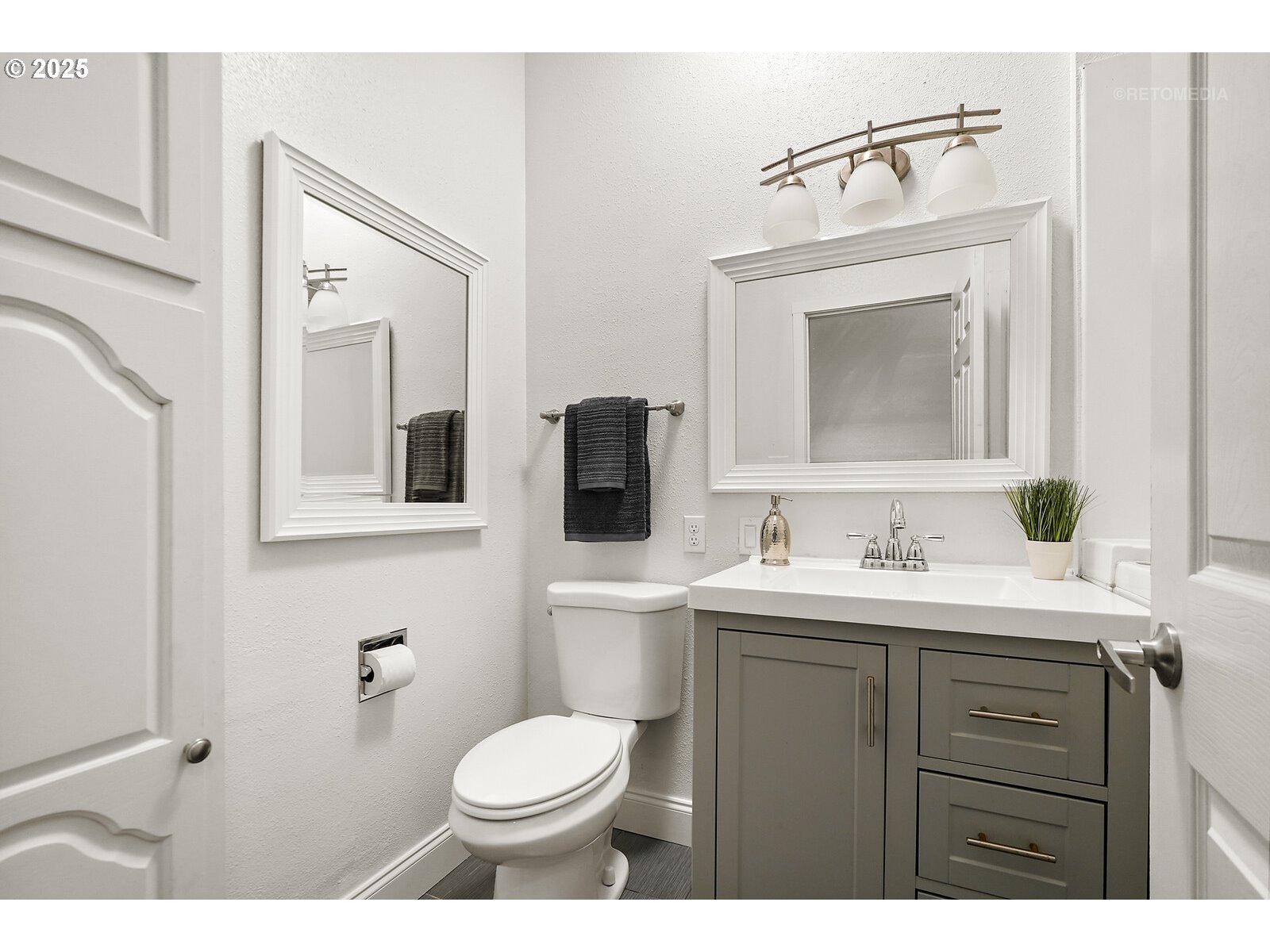 57647 Cedar Springs Drive Scappoose, OR 97056 - Photo 21 of 48 a bathroom with a toilet a sink a vanity and mirror