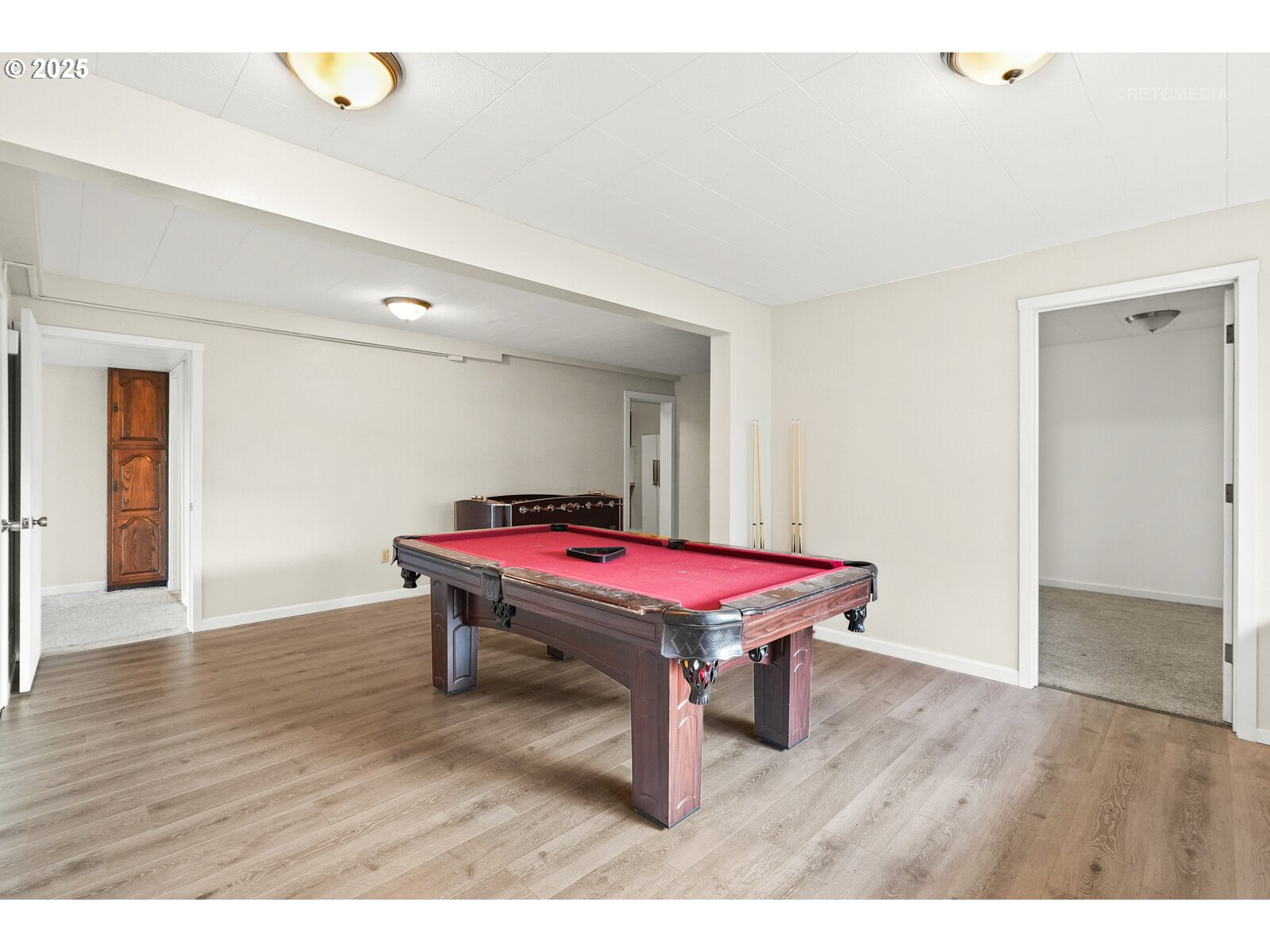 57647 Cedar Springs Drive Scappoose, OR 97056 - Photo 26 of 48 a room with pool table wooden floor and windows