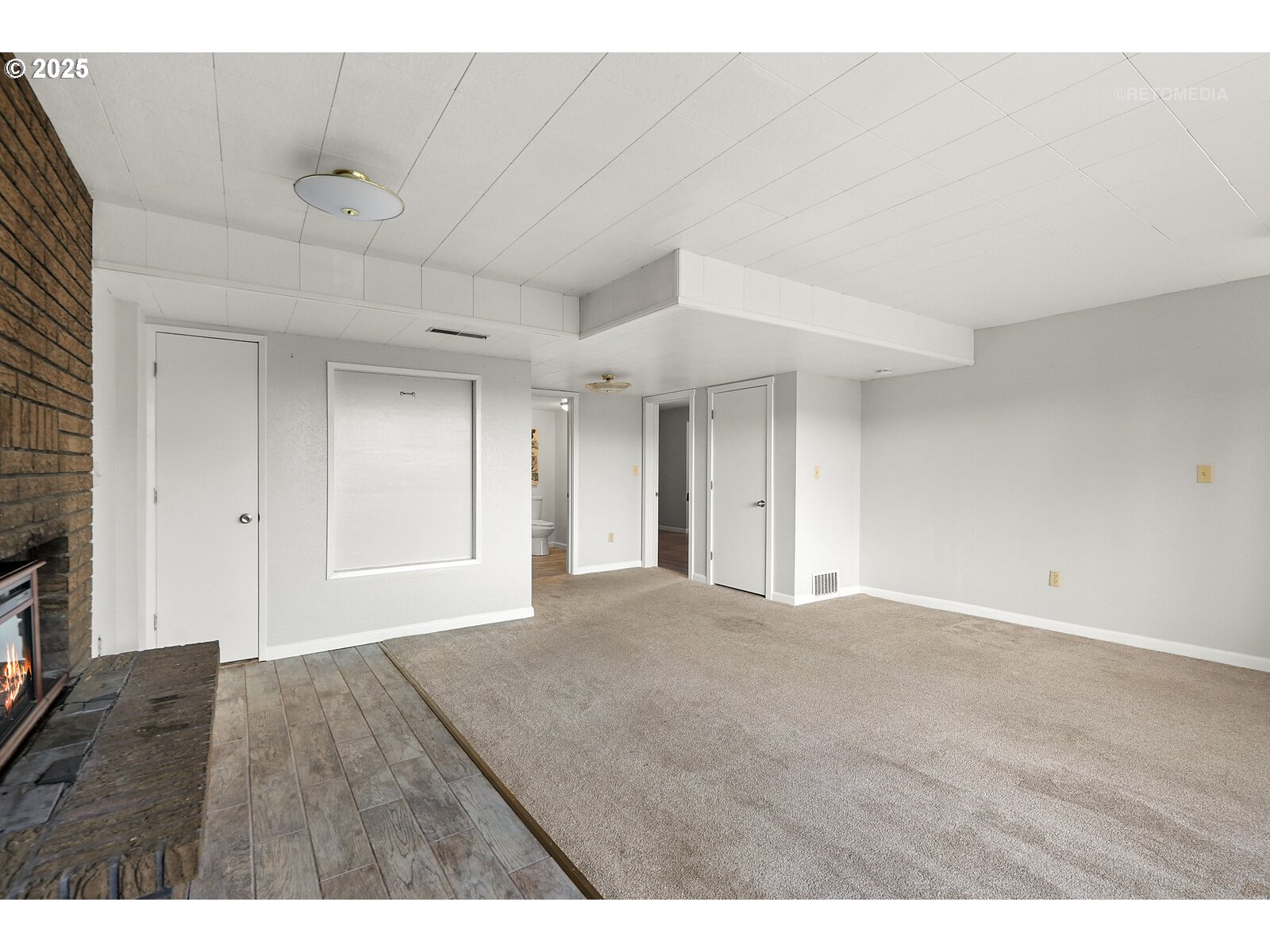 57647 Cedar Springs Drive Scappoose, OR 97056 - Photo 29 of 48 a view of an empty room with wooden floor