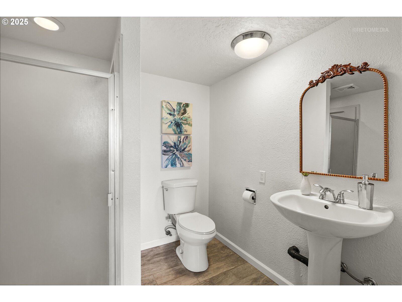 57647 Cedar Springs Drive Scappoose, OR 97056 - Photo 30 of 48 a bathroom with a toilet sink and mirror